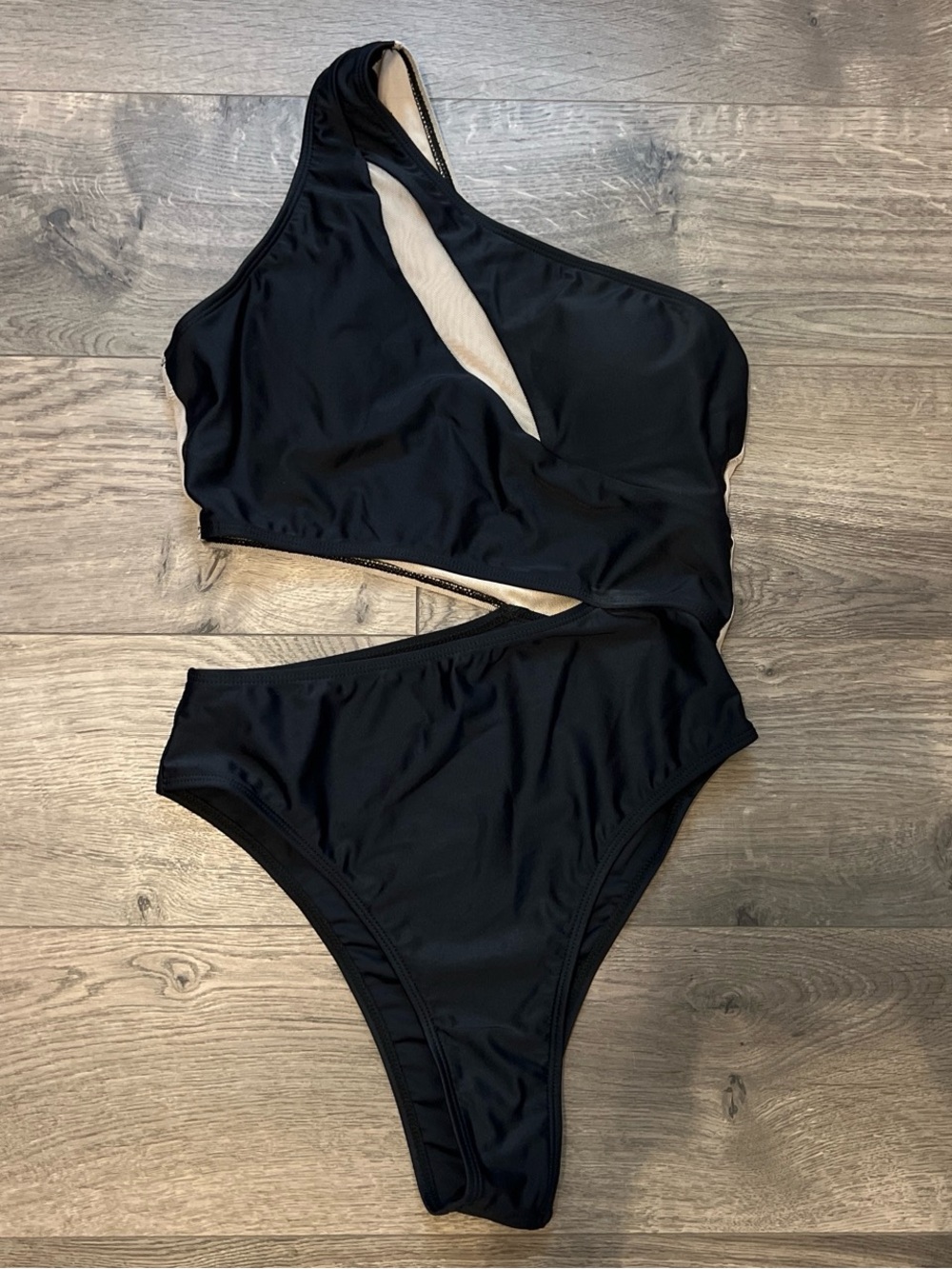 One-Shoulder / Asymmetrical Cut  Black one piece swimsuit with cutout detail s